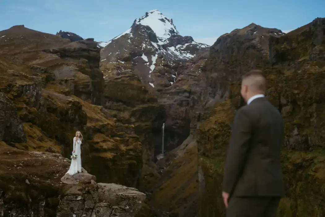Elopement couple in the mountains, bride in focus but groom is not